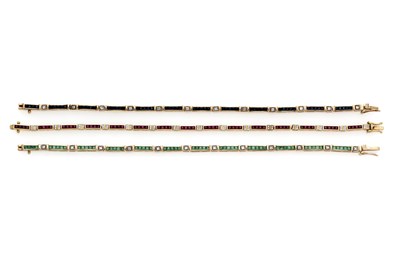 Lot 341 - A SET OF THREE GOLD , GEM-SET AND DIAMOND LINE BRACELETS, 1990s