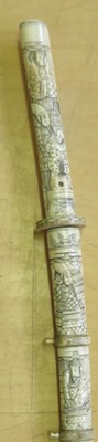 Lot 16 - ËœAN IVORY TACHI WITH RELIGIOUS AND SAMURAI CARVINGS
