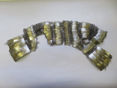 Lot 62 - â’¶ THE CENTRAL PORTION OF AN INDIAN MAIL AND LAMELLAR SHIRT, 17TH CENTURY