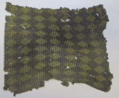 Lot 64 - â’¶ A SMALL PORTION OF AN INDIAN MAIL SHIRT, 19TH CENTURY