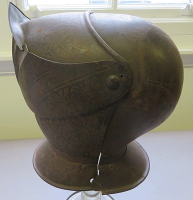 Lot 227 - â€¡ A CLOSE HELMET IN THE WESTERN EUROPEAN STYLE OF THE 16TH CENTURY, 19TH CENTURY