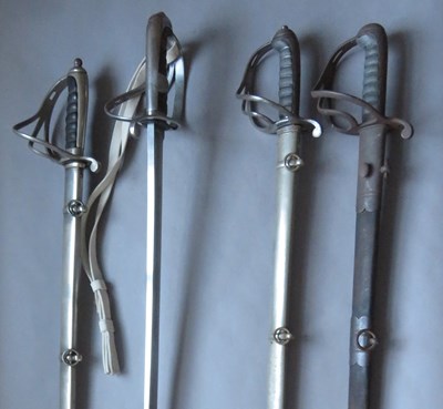 Lot 343 - â’¶ A VICTORIAN OFFICER'S SWORD, ANOTHER AND TWO ARTILLERY OFFICER'S SWORDS