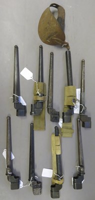 Lot 372 - â’¶ THE HILT OF AN 1858 PATTERN CUTLASS BAYONET AND NINE SPIKE BAYONETS