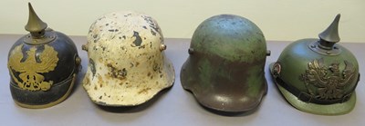 Lot 422 - â’¶ FOUR GERMAN HELMETS