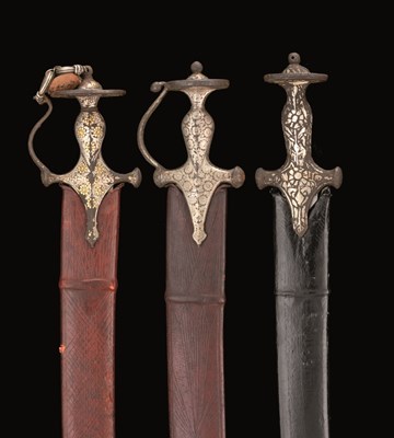 Lot 27 - THREE INDIAN TALWARS WITH DECORATED HILTS
