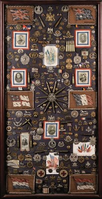 Lot 214 - A COMPREHENSIVE FRAMED AND GLAZED DISPLAY OF WORLD WAR I CAP BADGES