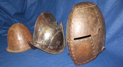 Lot 242 - A HELM IN 14TH CENTURY STYLE AND TWO MORIONS IN EARLY 17TH CENTURY STYLE