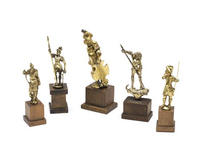 Lot 139 - **FIVE GILT-METAL FIGURAL CABINET FINIALS