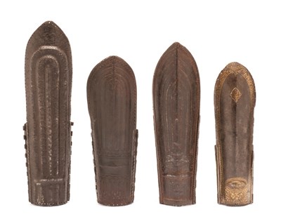 Lot 70 - FOUR INDIAN ARM GUARDS