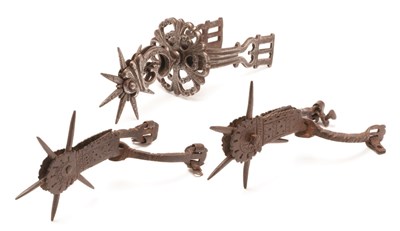 Lot 85 - A PAIR OF MEXICAN STEEL SPURS AND A SINGLE MEXICAN SPUR