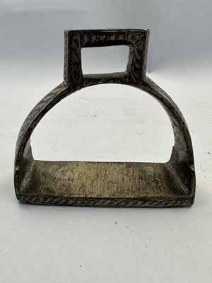 Lot 549 - A NORTH INDIAN COPPER ALLOY STIRRUP, LATE 19TH CENTURY, POSSIBLY RAJASTHAN