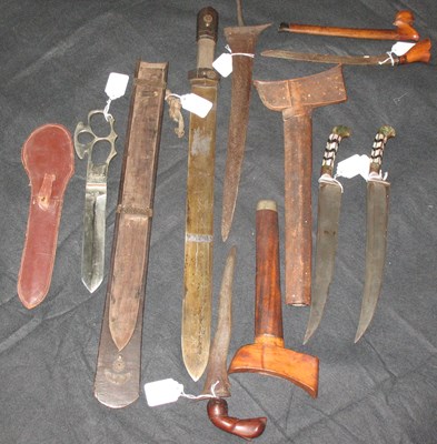 Lot 36 - TWO INDIAN DAGGERS (PESH KABZ); A MALAYSIAN DAGGER (BADE BADE); AN INDIAN KNIFE; A SOUTH-EAST ASIAN