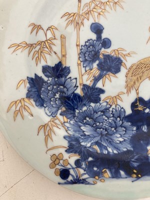 Lot 56 - A CHINESE BLUE AND GILT 'CRANE AND BAMBOO' PLATE, QING DYNASTY, YONGZHENG PERIOD (1723-35)