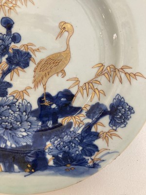 Lot 56 - A CHINESE BLUE AND GILT 'CRANE AND BAMBOO' PLATE, QING DYNASTY, YONGZHENG PERIOD (1723-35)