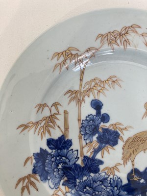 Lot 56 - A CHINESE BLUE AND GILT 'CRANE AND BAMBOO' PLATE, QING DYNASTY, YONGZHENG PERIOD (1723-35)