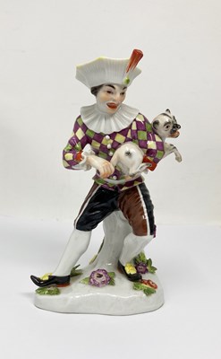 Lot 10 - A MEISSEN FIGURE OF HARLEQUIN PLAYING A PUG, 20TH CENTURY