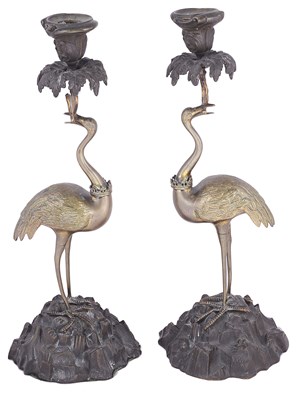 Lot 336 - A PAIR OF BRONZE AND BRASS 'STORK' CANDLESTICKS