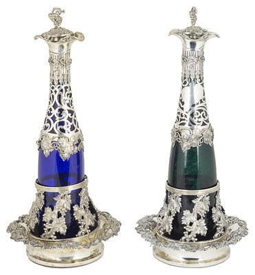 Lot 363 - A pair of German silver-mounted glass decanters on SILVER coasters