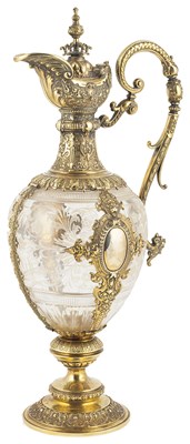 Lot 378 - A GERMAN SILVER-GILT AND GLASS CLARET JUG