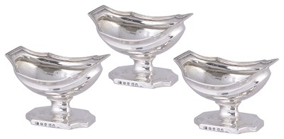 Lot 465 - A SET OF THREE GEORGE III SILVER SALT CELLARS