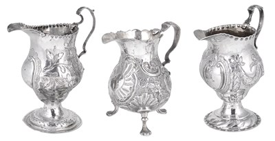 Lot 486 - THREE GEORGIAN SILVER MILK JUGS