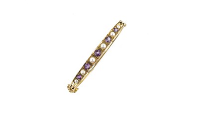 Lot 615 - NINE CARAT GOLD, AMETHYST AND PEARL BANGLE