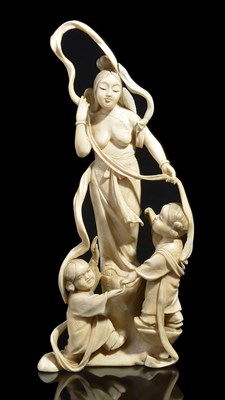 Lot 103 - ~A JAPANESE IVORY OKIMONO OF AN ANGEL AND TWO CHILDREN
