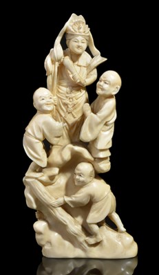 Lot 105 - ~A JAPANESE IVORY OKIMONO OF A MAN AND BOYS WITH BAMBOO LADDER