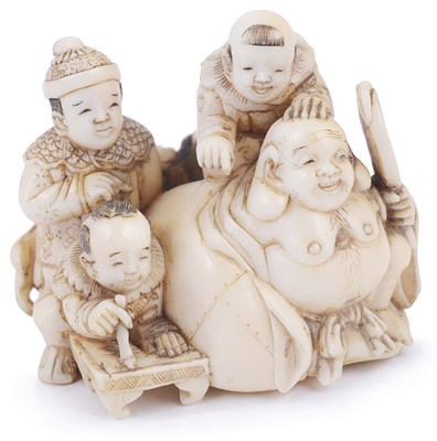 Lot 128 - ~IVORY NETSUKE OF THE LUCKY GOD HOTEI WITH CHILDREN