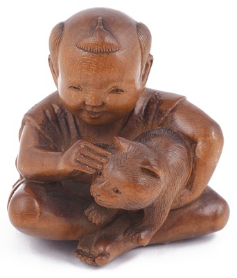 Lot 137 - WOOD NETSUKE OF A BOY PETTING A CAT