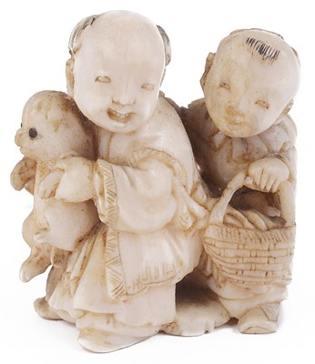 Lot 142 - ~IVORY NETSUKE OF TWO BOYS WITH A PUPPY
