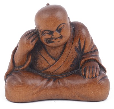 Lot 158 - ~WOOD NETSUKE OF A MAN PICKING HIS EAR