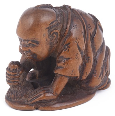 Lot 162 - BOXWOOD NETSUKE OF A MAN POLISHING THE CHARACTER KOKORO (HEART)