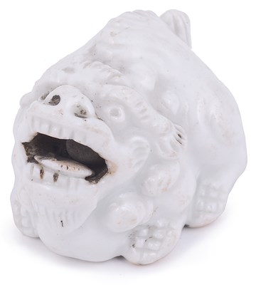 Lot 181 - PORCELAIN NETSUKE OF A CROUCHING SHISHI LION