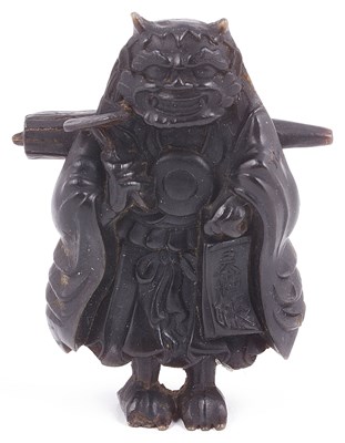 Lot 183 - MOULDED CASEIN NETSUKE OF ONI NO NEMBUTSU