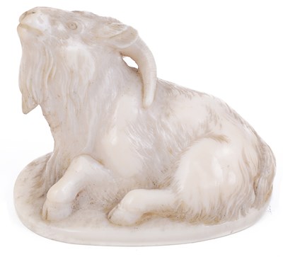 Lot 184 - ~IVORY NETSUKE OF A RECUMBENT GOAT