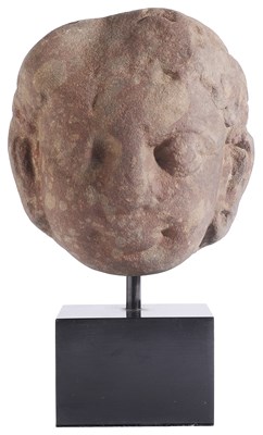 Lot 219 - A KUSHAN MOTTLED PINK SANDSTONE HEAD