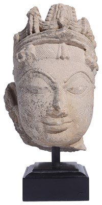 Lot 220 - A BUFF SANDSTONE HEAD OF A DEITY