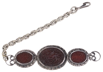 Lot 309 - â€¡A SILVER AND CARNELIAN ARMLET
