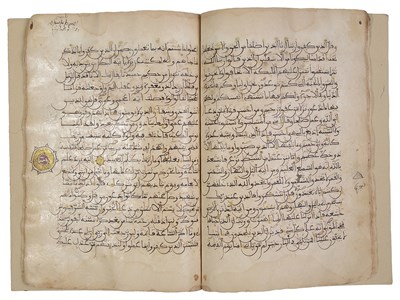 Lot 332 - A FRAGMENT OF A MAGHRIBI QUR'AN