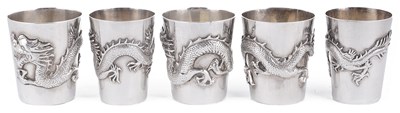 Lot 449 - A SET OF THREE CHINESE SILVER VODKA TOTS (MINIATURE BEAKERS)