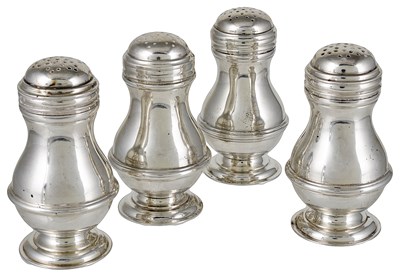 Lot 500 - A SET OF FOUR SILVER BUN PEPPERS
