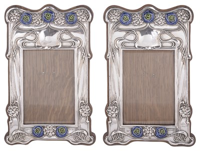 Lot 517 - A PAIR OF EDWARDIAN SILVER-MOUNTED PHOTOGRAPH FRAMES