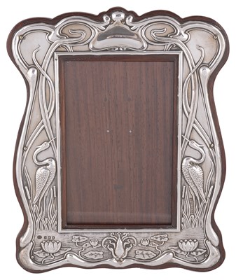Lot 521 - AN EDWARDIAN SILVER-MOUNTED PHOTOGRAPH FRAME