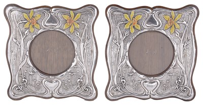 Lot 536 - A PAIR OF EDWARDIAN SILVER-MOUNTED PHOTOGRAPH FRAMES
