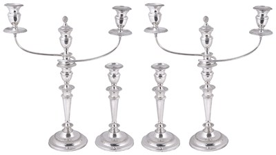 Lot 552 - A SUITE OF FOUR GEORGE III SILVER CANDLESTICKS AND A PAIR OF CANDELABRA BRANCHES