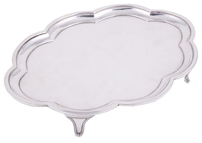 Lot 555 - A GEORGE III SILVER TEAPOT STAND