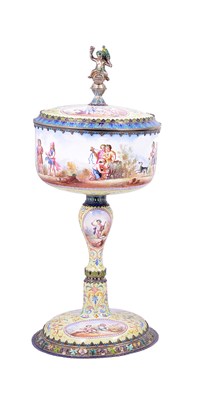 Lot 634 - AN AUSTRO-HUNGARIAN SILVER-GILT-MOUNTED ENAMEL PEDESTAL CUP AND COVER
