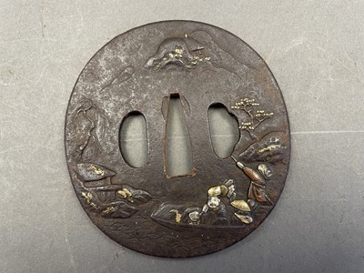 Lot 501 - A JAPANESE IRON TSUBA (HAND GUARD) OF MARU GATA (ROUND FORM), CIRCA 1700-1800