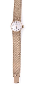 Lot 681 - OMEGA: A LADY'S GOLD BRACELET WATCH